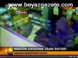 Bebeğin Kafasına Silah Dayadı