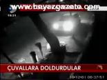 Çuvallara Dolduruyor