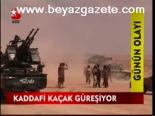 Kaddafi Kaçak Güreşiyor