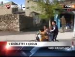 1 Bisiklette 4 Çocuk