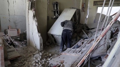 Syrian elder seeks memories in debris of E. Ghouta home