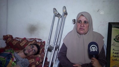 tekerlekli sandalye - Gazzeli annenin İsrail'in yaraladığı oğullarına yetme çabası - GAZZE  Videosu