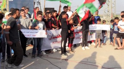 insanlik sucu - Gazzeli sporcular İsrail ablukasını protesto etti - GAZZE Videosu