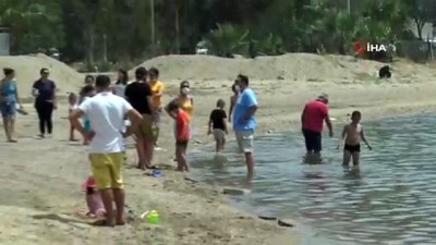  Çocukların ilk işi denize girmek oldu