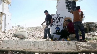 diktatorluk -  - Suriyeli sanatçı, yıkılan binanın duvarı üzerinde Floyd’un resimini çizdi Videosu