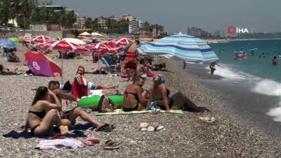 yerli turist -  Antalya'da tatilciler sahilleri doldurmaya başladı Videosu