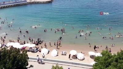  Sıcaklıklar arttı, vatandaşlar soluğu Caddebostan Plajı'nda aldı